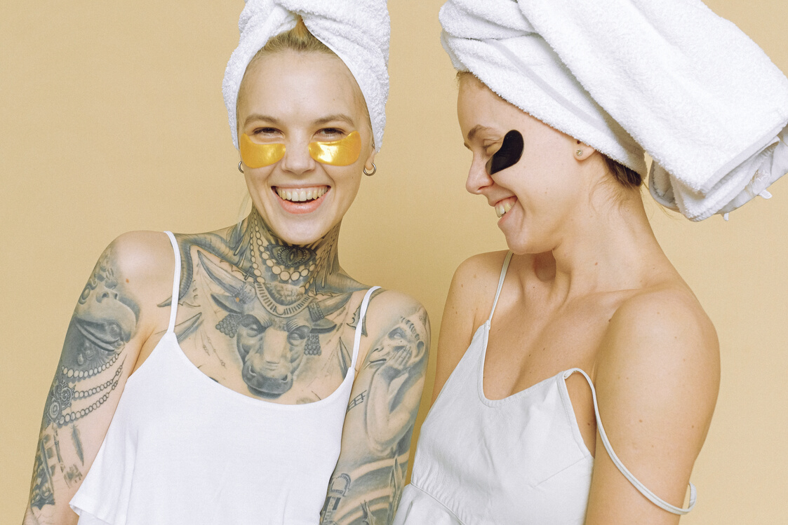 Laughing women in eye patches on face